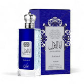 A rectangular perfume bottle with an intricate silver cap and a deep blue label displaying "Ana Al Awwal" and "Nusuk" in both Arabic and English. This sophisticated scent, named Ana Al Awwal Blue EDP Perfume for Men (3.4 oz/100 ml), is elegantly packaged in a matching blue and silver box that echoes the bottle's design and text for a refined touch.