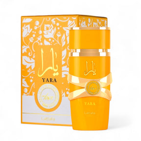 The Yara Tous EDP Perfume for Women by Lattafa comes in a yellow bottle adorned with gold accents, exuding tropical elegance. The bottle is labeled "Yara" and is paired with a matching box that features floral patterns and Arabic script, further emphasizing the luxurious fragrance experience from Lattafa.